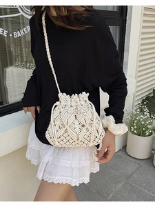 Vintage crochet bucket bag in cream white with geometric hollow pattern for beach vacations