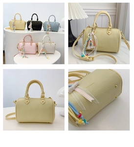 Detail of Boston mini handbag with litchi grain texture and rainbow charms