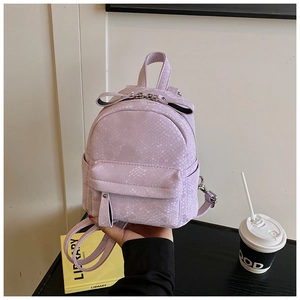 Detail view of mini taro purple backpack featuring a textured snakeskin pattern