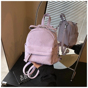 Detail of lavender faux snake texture mini backpack with mirror reflection showing both sides