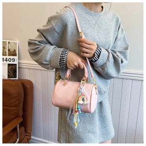 Pink lychee grain leather Boston bag with rainbow charm and adjustable shoulder strap