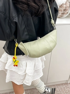 Chic pistachio green half-moon crossbody bag with litchi texture and cute duck charm