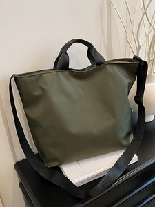 Large capacity olive green nylon tote bag with black straps for versatile daily commuting