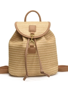 Large woven straw backpack with beige texture and brown leather straps for summer travel