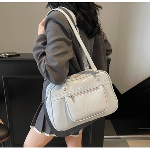 Detail of light blue oil wax leather backpack with front zipper pocket and logo