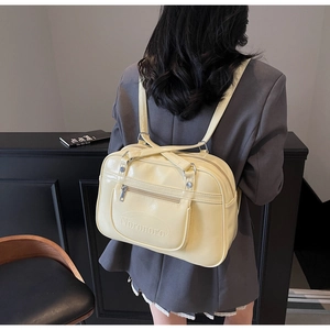 Detailed view of cream yellow large capacity shoulder bag with Noronoro embossed text