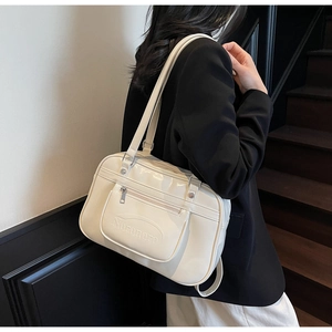 Side view of cream white PU leather multi-purpose tote bag showing the wear proportions