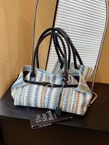 Ethnic summer straw woven underarm bag with blue wavy pattern and leather handle