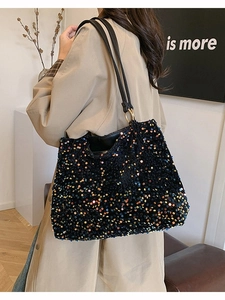 Chic black tote bag with shimmering colorful sequins and gold ring hardware details