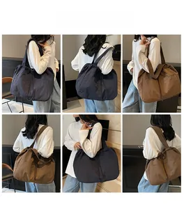 Detail shots of large nylon tote bag with drawstring closure in blue and brown