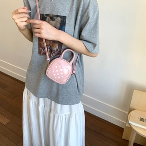 Pink heart-pattern mini crossbody bag in retro oil leather with adjustable shoulder strap