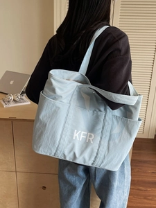 Large light blue canvas tote bag for commuting with KFR print and side pocket
