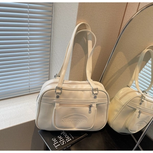 Creamy white glossy leather Boston bag detail with front zipper pocket and embossed logo