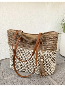 Straw tote bag with brown weave and white mesh design for summer beach vacation