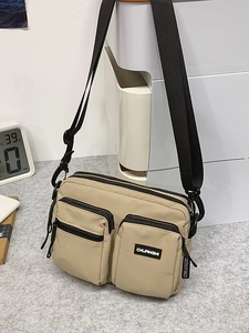 Sac bandoulière en nylon kaki avec sangle réglable et multiples poches zippées