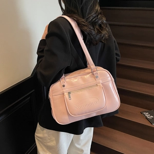 Pink patent leather Boston bag with shoulder straps and embossed lettering for women