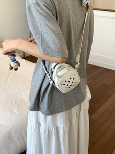 White heart-shaped mini shoulder bag with polka dots and penguin charm for women