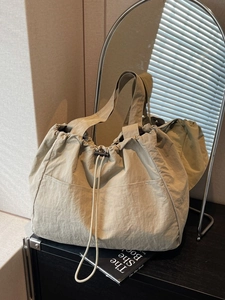 Large capacity olive beige nylon tote bag with drawstring closure and wide shoulder strap