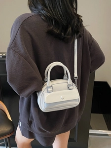 Minimalist grey blue leather pillow bag for women with top handles and adjustable strap