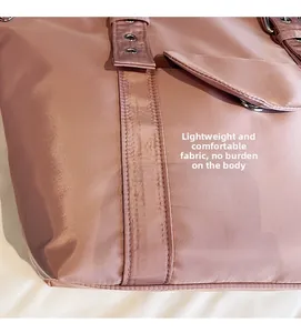 Close-up of lightweight nylon fabric and reinforced strap with metal eyelet detail