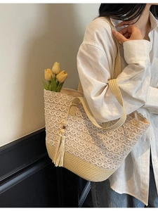 Straw tote bag with white lace floral overlay and wood bead tassel for summer beach