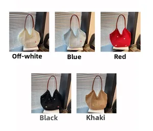 Detail view of woven hollow tote bags showing five colors with leather straps and bow