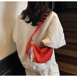 Red half-moon crossbody bag in nylon with adjustable strap and NICE charm detail