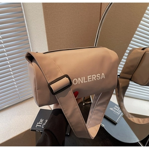 Detail view of Onlersa nylon barrel bag with wide strap and white printed lettering
