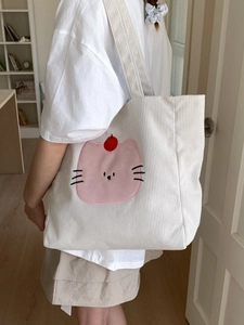 Sac cabas minimaliste en velours côtelé beige avec broderie chat rose à l'épaule