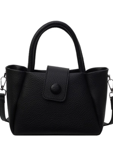 Fashionable black pebbled leather bucket bag with top handle and adjustable shoulder strap