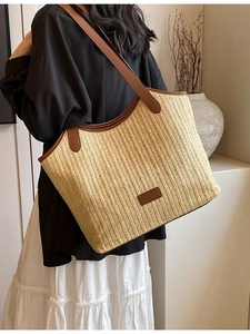 Fashion straw woven tote bag with brown leather straps and front label for women