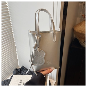 Silver mini bucket bag with metallic PU leather finish and cute animal charm detail