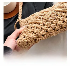 Macro shot showing tight hollow knit pattern and woven texture of the khaki cotton bag