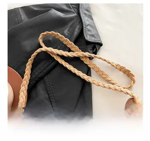Close-up of hollow knit texture and wide woven shoulder strap on the crochet crossbody bag