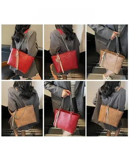 Detailed views of large capacity tote bag with metal chain straps and tassel charm detail