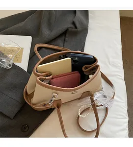 Detailed interior of the beige canvas tote bag showing spacious storage for daily essentials