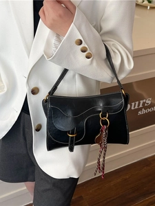 Classic black leather saddle bag with contrast stitching and vintage gold buckle for women