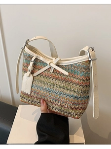 Woven hobo bag with colorful chevron pattern and cream leather shoulder strap