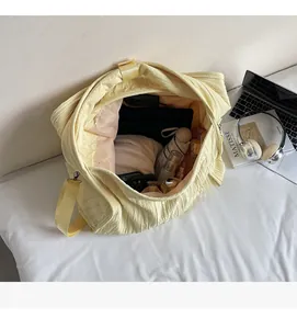 Interior view showing the large storage capacity of a yellow wrinkled fabric tote bag