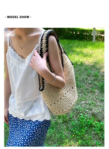 Close-up of hand-woven straw tote bag featuring detailed hollow-out patterns and black trim