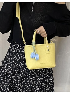 Minimalist yellow lychee pattern bucket bag with blue tulip charms and strap