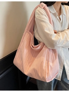 Large light pink pleated shoulder bag for women with wide strap for daily commute