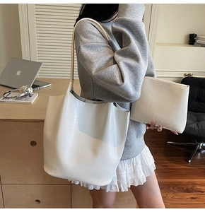 Detailed view of white crocodile pattern tote bag set with matching small zipper pouch