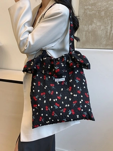 Mesh shoulder bag with cherry floral print and ruffle trim for a sweet minimalist look