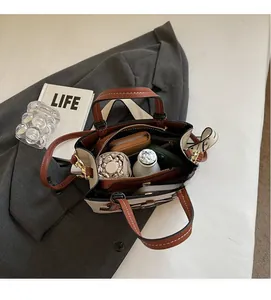 Top view of spacious interior of the tote bag holding umbrella, wallet, and essentials