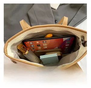 Interior view showing the large storage capacity of this woven apricot tote bag for essentials