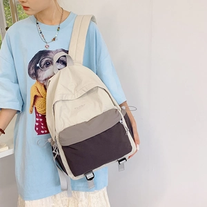 Nylon backpack with color-blocking design featuring adjustable straps and zipper pockets