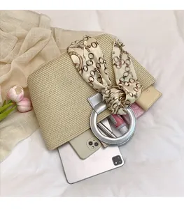 Top view of woven tote bag with round metal handle showing interior storage capacity