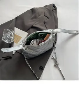 Silver quilted metallic handbag interior showing space for phones and lipstick