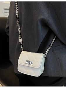 White quilted mini crossbody bag for girls with silver chain strap and metal buckle